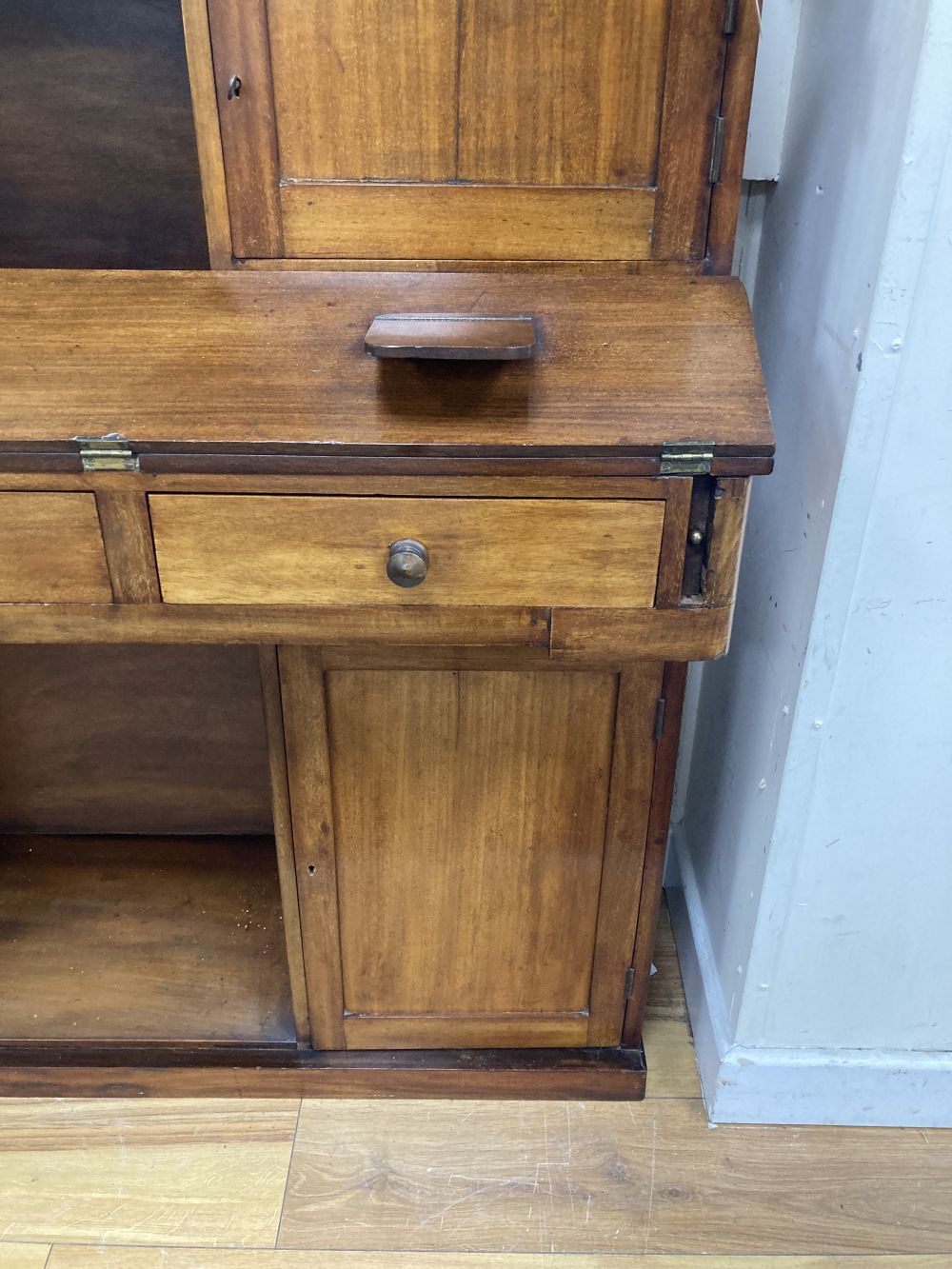 A panelled mahogany secretaire cabinet, width 119cm, depth 37cm, height 109cm